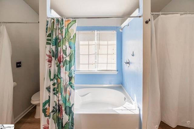 full bath featuring toilet, curtained shower, and a bath