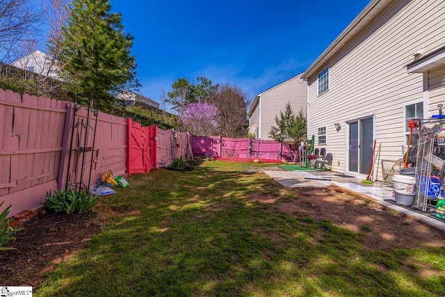 view of yard featuring a fenced backyard and a patio