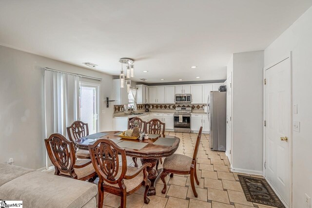 dining area featuring recessed lighting