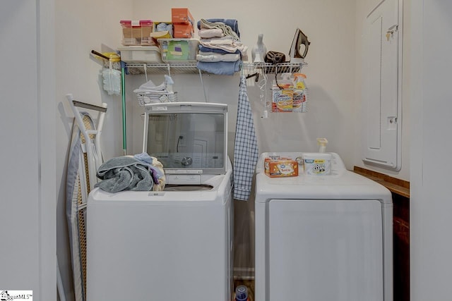 laundry room with separate washer and dryer and laundry area