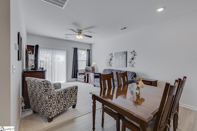 dining space with visible vents, light wood-style flooring, ceiling fan, and recessed lighting