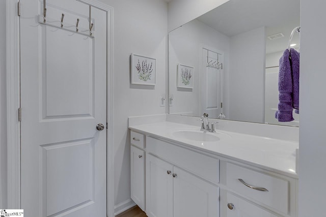 bathroom featuring visible vents and vanity