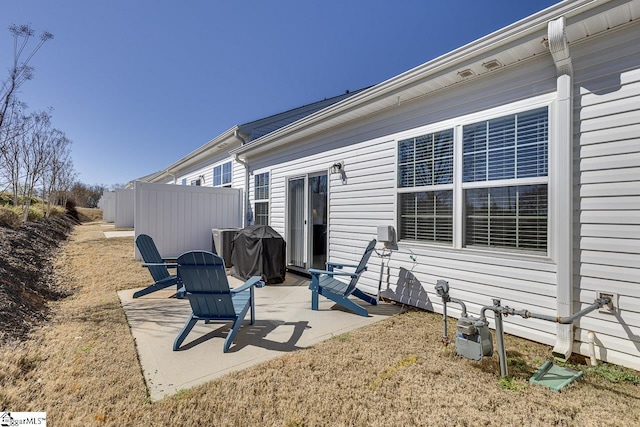 view of patio featuring fence