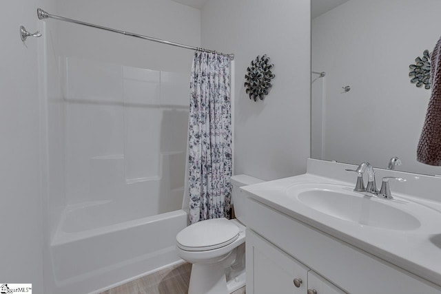 full bath featuring shower / bathtub combination with curtain, toilet, and vanity