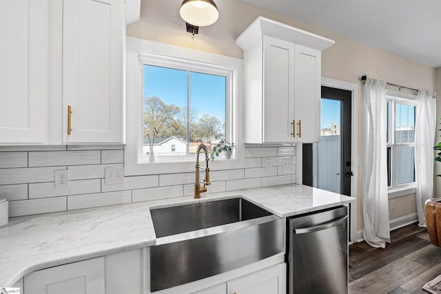 130 Park Ave, Greer, SC 29651 - kitchen featuring dishwasher, white cabinetry, a sink, and tasteful backsplash