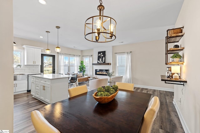 130 Park Ave, Greer, SC 29651 - dining area with dark wood finished floors, baseboards, and a healthy amount of sunlight