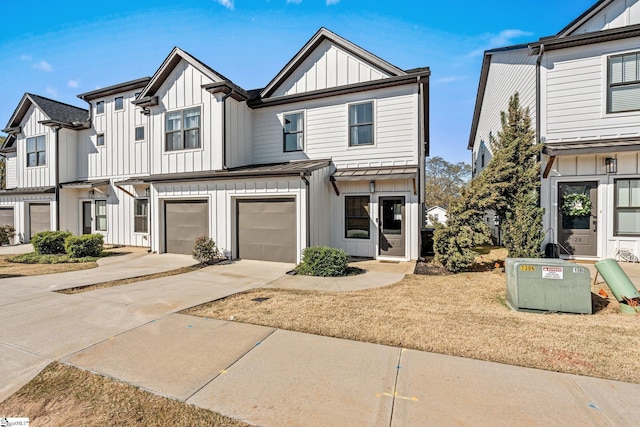 130 Park Ave, Greer, SC 29651 - view of front of property with driveway, a garage, and board and batten siding