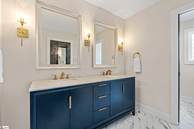 130 Park Ave, Greer, SC 29651 - full bathroom with baseboards, marble finish floor, a sink, and double vanity