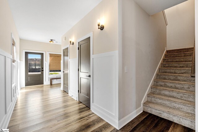 130 Park Ave, Greer, SC 29651 - staircase featuring a wainscoted wall, wood finished floors, and a decorative wall