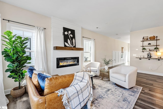 130 Park Ave, Greer, SC 29651 - living area featuring a wealth of natural light, wood finished floors, baseboards, and a large fireplace