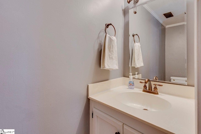 bathroom with vanity and crown molding