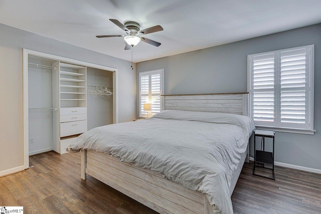 bedroom with baseboards, a closet, wood finished floors, and a ceiling fan