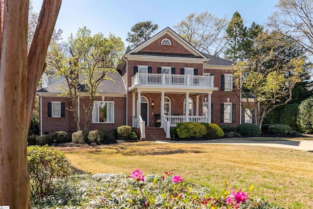 6 Bentford Ct, Simpsonville, SC 29681 - colonial home featuring a balcony, brick siding, a front lawn, a shingled roof, and a porch