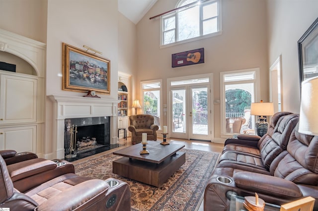 6 Bentford Ct, Simpsonville, SC 29681 - living area featuring wood finished floors, built in features, a fireplace, and a wealth of natural light
