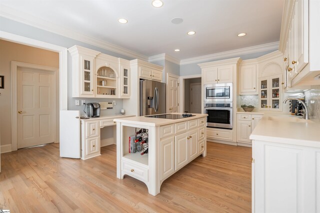 6 Bentford Ct, Simpsonville, SC 29681 - kitchen with open shelves, light wood-type flooring, stainless steel appliances, a center island, and a sink