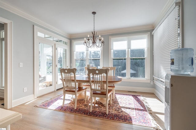 6 Bentford Ct, Simpsonville, SC 29681 - dining area with a notable chandelier, crown molding, light wood-type flooring, baseboards, and visible vents