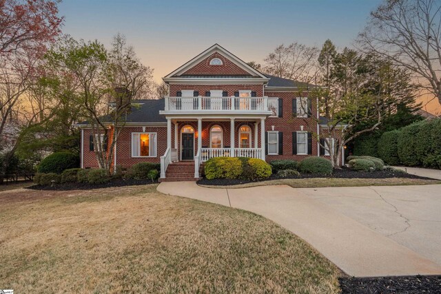 6 Bentford Ct, Simpsonville, SC 29681 - colonial inspired home with covered porch, a balcony, brick siding, and a yard