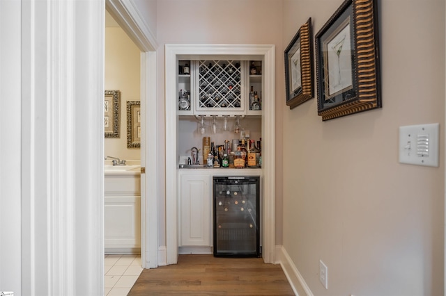 6 Bentford Ct, Simpsonville, SC 29681 - bar with a bar, baseboards, and beverage cooler