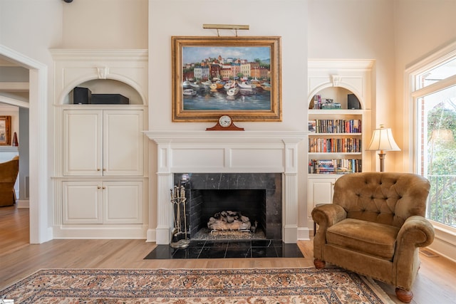 6 Bentford Ct, Simpsonville, SC 29681 - interior space featuring a high end fireplace, wood finished floors, built in features, and a wealth of natural light