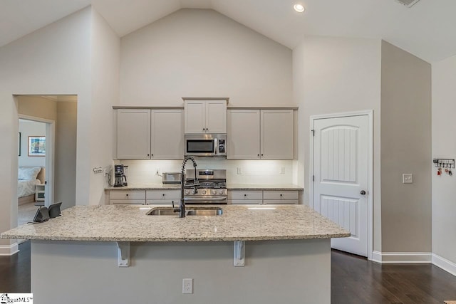 105 Cooper Oaks Ct, Simpsonville, SC 29681 - kitchen featuring a breakfast bar area, high vaulted ceiling, a sink, and stainless steel appliances