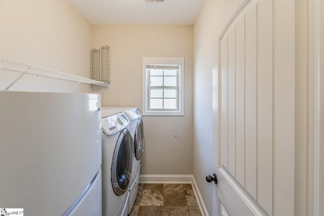 105 Cooper Oaks Ct, Simpsonville, SC 29681 - laundry area with baseboards, washer and dryer, and laundry area