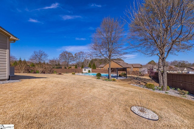 105 Cooper Oaks Ct, Simpsonville, SC 29681 - view of yard with a fenced backyard, a storage shed, an outbuilding, and a fenced in pool