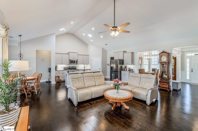 105 Cooper Oaks Ct, Simpsonville, SC 29681 - living room featuring high vaulted ceiling, ceiling fan with notable chandelier, baseboards, and dark wood finished floors