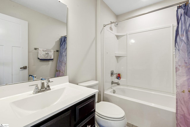 bathroom featuring shower / bath combo, toilet, and vanity