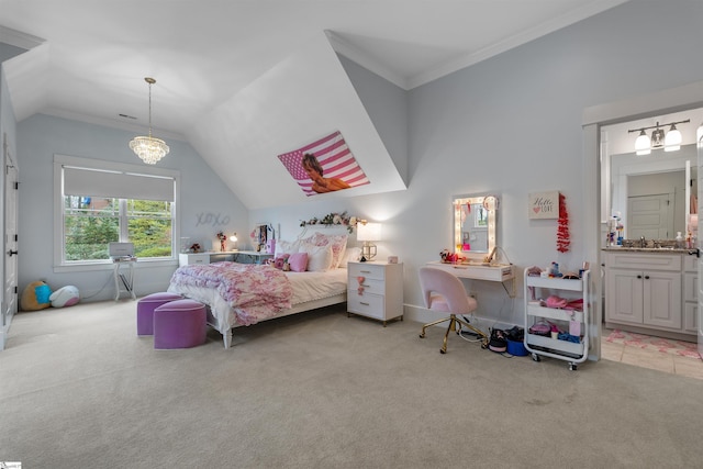 carpeted bedroom featuring vaulted ceiling, crown molding, a notable chandelier, and ensuite bath