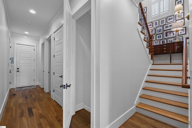stairway with recessed lighting, baseboards, and wood finished floors