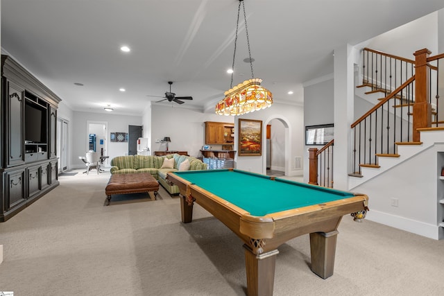 rec room with arched walkways, ceiling fan, recessed lighting, and light colored carpet
