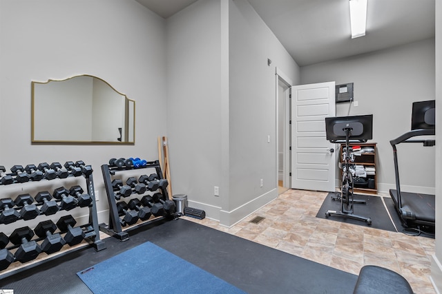 workout area featuring baseboards and visible vents
