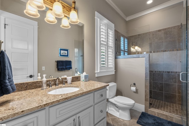 bathroom featuring ornamental molding, a tile shower, toilet, vanity, and tile patterned flooring