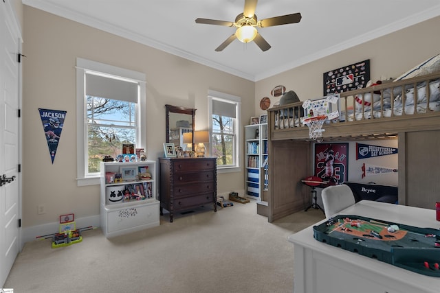 bedroom with carpet floors, ceiling fan, and crown molding