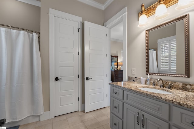 full bath with a shower with curtain, tile patterned flooring, vanity, and crown molding