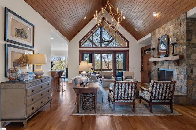 living room with high vaulted ceiling, wood finished floors, wood ceiling, and a chandelier