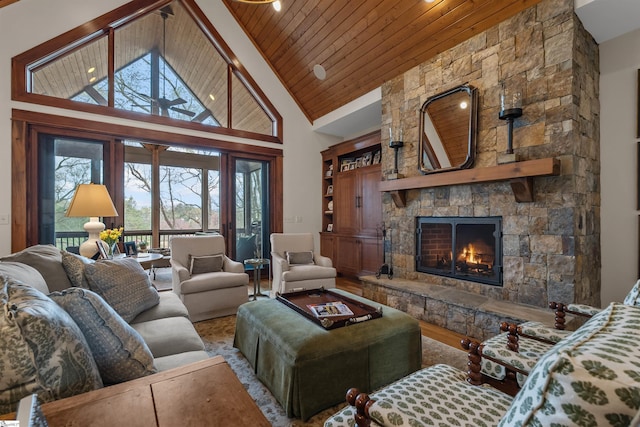 living room featuring a fireplace, high vaulted ceiling, wooden ceiling, and wood finished floors