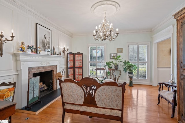 dining area with ornamental molding, a chandelier, and a wealth of natural light