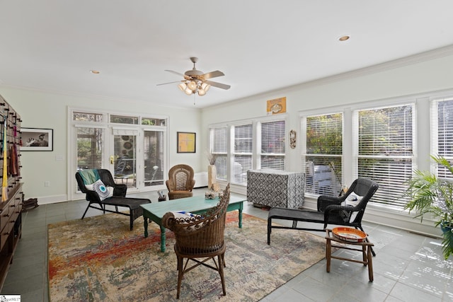 interior space with tile patterned floors, ornamental molding, baseboards, and a wealth of natural light