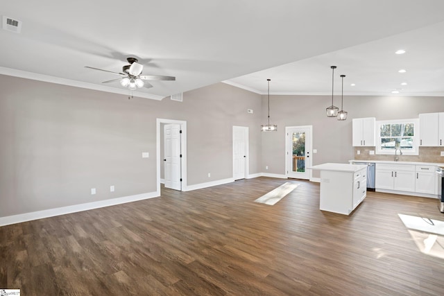 225 Cedar St, Woodruff, SC 29388 - kitchen featuring crown molding, dishwasher, a center island, open floor plan, and ceiling fan with notable chandelier
