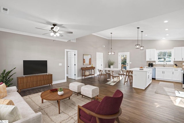 225 Cedar St, Woodruff, SC 29388 - living room with ornamental molding, visible vents, a ceiling fan, and light wood-type flooring