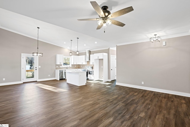 225 Cedar St, Woodruff, SC 29388 - unfurnished living room featuring dark wood-style flooring, vaulted ceiling, crown molding, and ceiling fan with notable chandelier