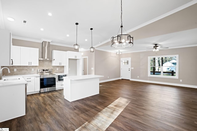 225 Cedar St, Woodruff, SC 29388 - kitchen with crown molding, stainless steel range with electric stovetop, decorative backsplash, a sink, and wall chimney range hood