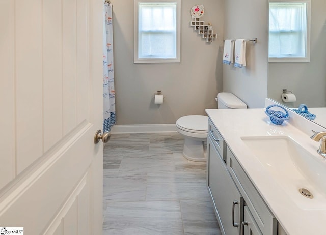 7 Ridgebury Pl, Greenville, SC 29607 - bathroom featuring a shower with shower curtain, baseboards, marble finish floor, toilet, and vanity
