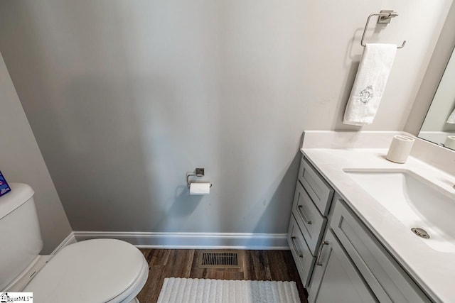 7 Ridgebury Pl, Greenville, SC 29607 - half bathroom featuring vanity, toilet, baseboards, visible vents, and wood finished floors