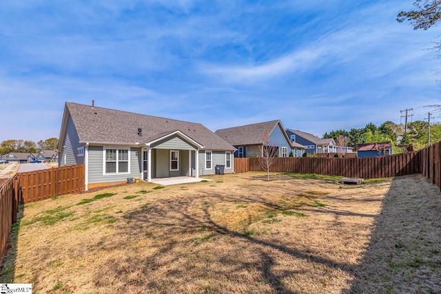 7 Ridgebury Pl, Greenville, SC 29607 - rear view of house featuring a fenced backyard, roof with shingles, a patio area, and a lawn