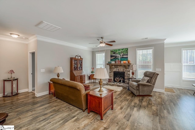 7 Ridgebury Pl, Greenville, SC 29607 - living room with a stone fireplace, wood finished floors, ceiling fan, and ornamental molding