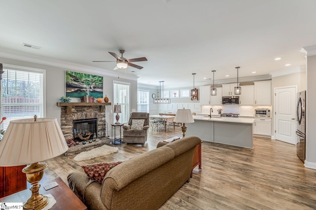 7 Ridgebury Pl, Greenville, SC 29607 - living area featuring a ceiling fan, plenty of natural light, crown molding, and visible vents