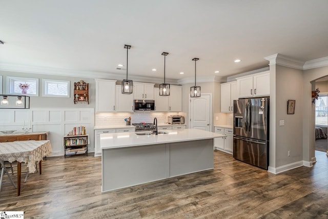 7 Ridgebury Pl, Greenville, SC 29607 - kitchen with light countertops, crown molding, stainless steel appliances, a sink, and backsplash