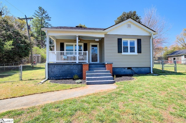 bungalow-style home featuring a front yard, a gate, covered porch, and a ceiling fan